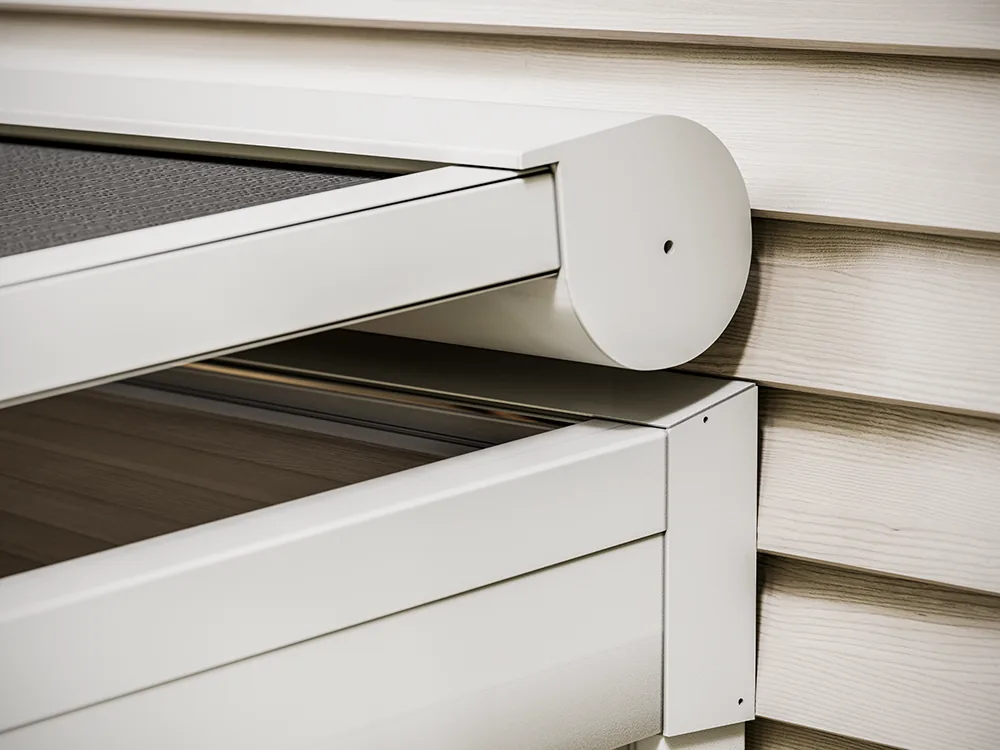 Round headbox end of a Sky 1500 spring ceiling zip screen seen from the side