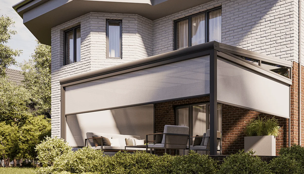 Zip screens at the corner of a house with grey fabric closing a covered sitting area