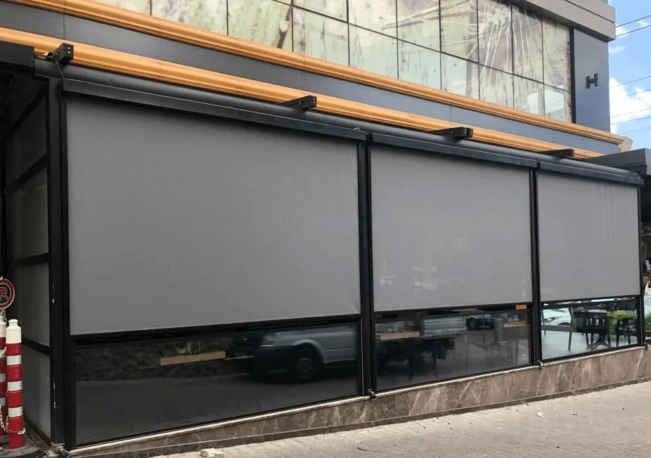 Commercial building with outdoor facade zip screens fitted across its openings
