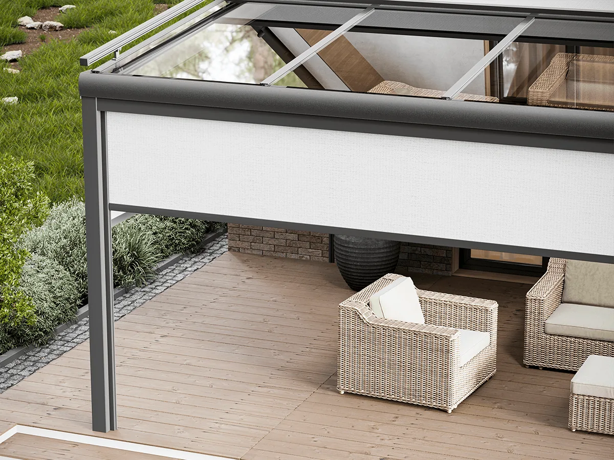 Terrace seating area protected by a facade zip screen along the open side